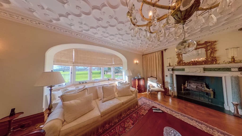 a living room filled with furniture and a fire place