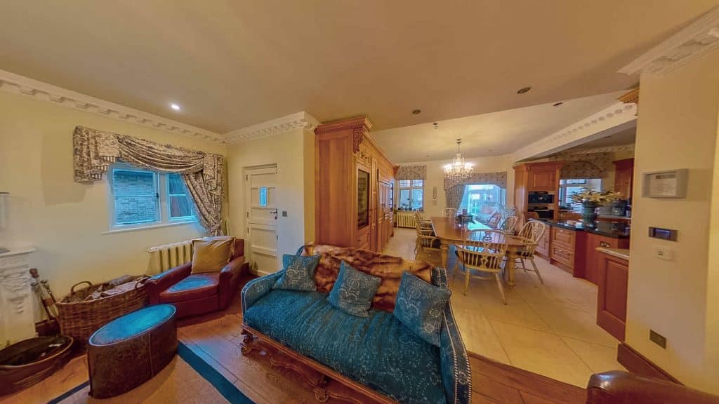 a living room filled with furniture and a large window