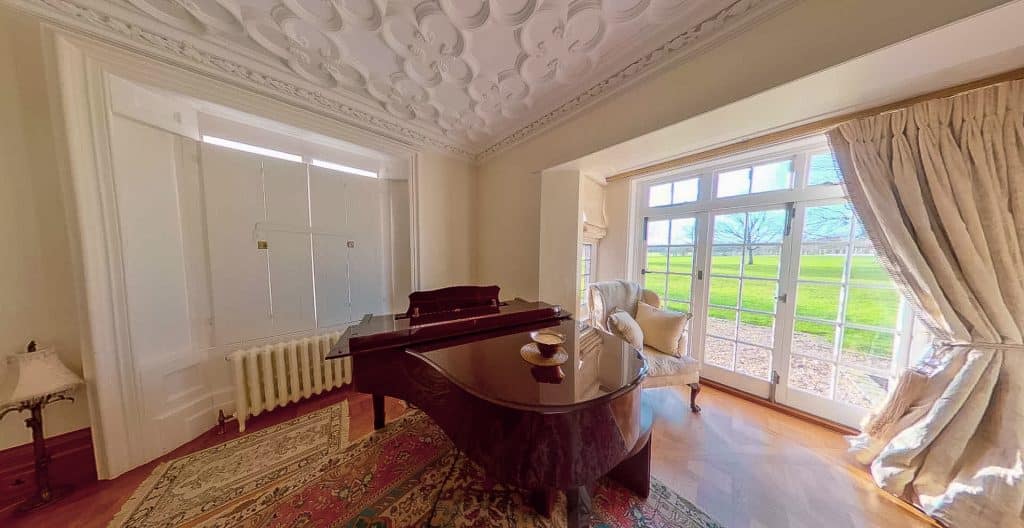 a living room filled with furniture and a large window