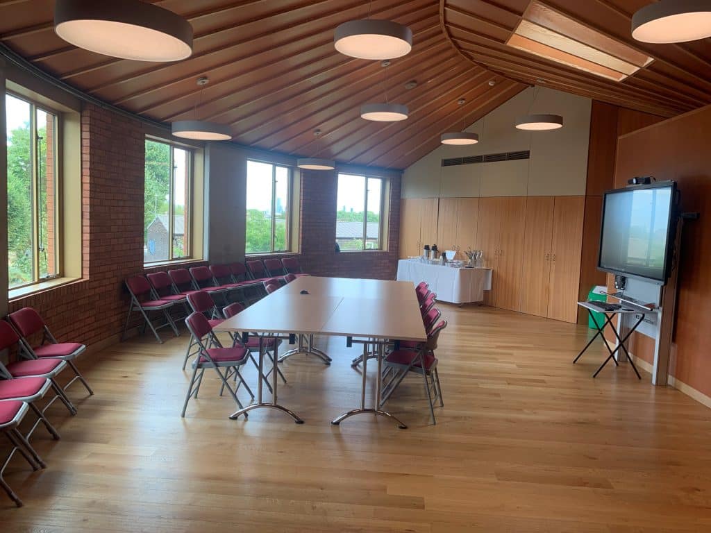 a room filled with furniture on top of a hard wood floor