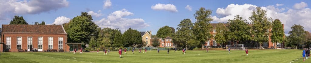 a group of people playing football on a field