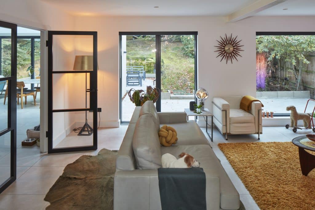 a view of a living room filled with furniture and a fire place