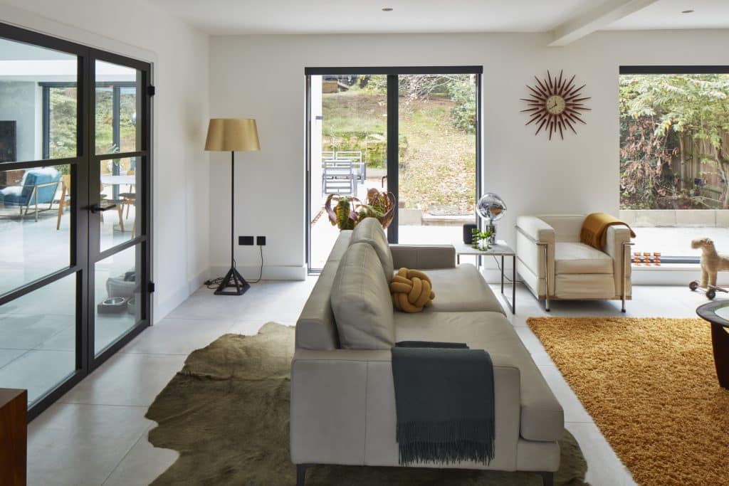 a view of a living room filled with furniture and a fire place