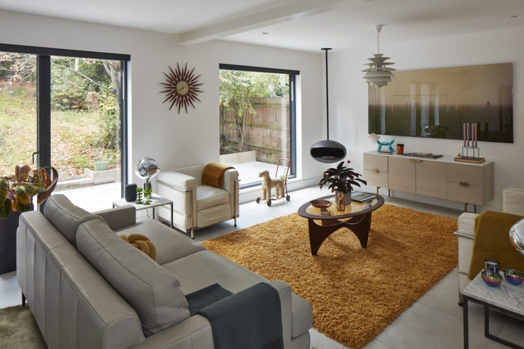 a living room filled with furniture and a flat screen tv
