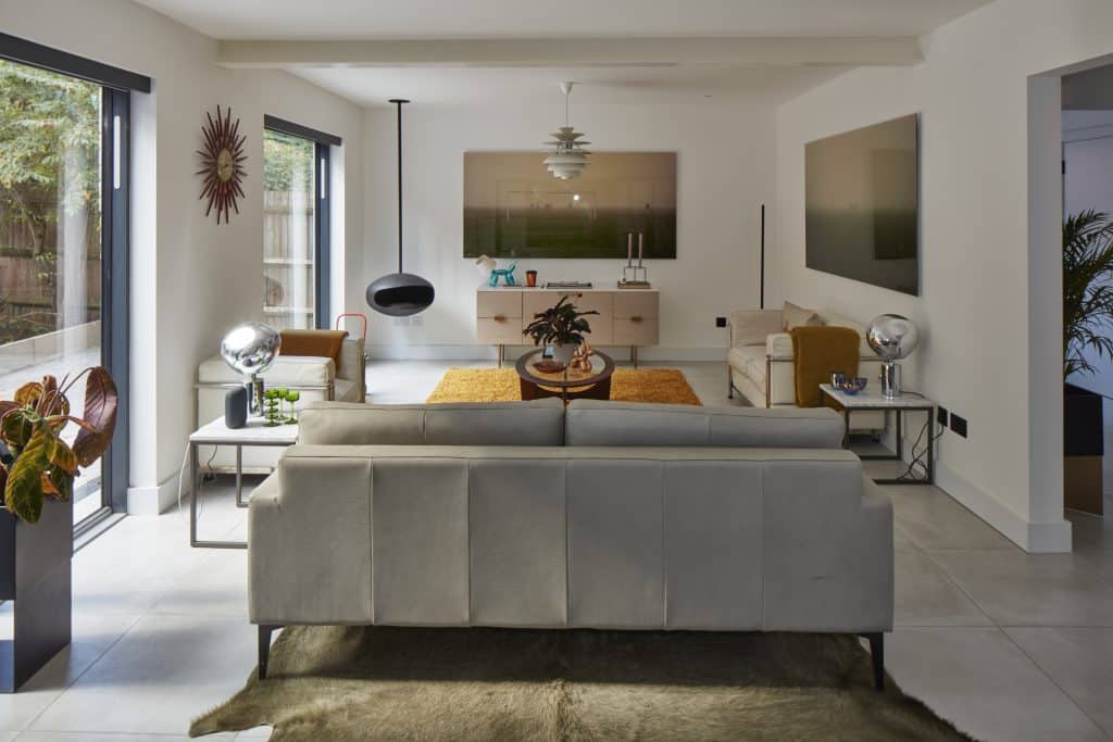 a living room filled with furniture and a large window