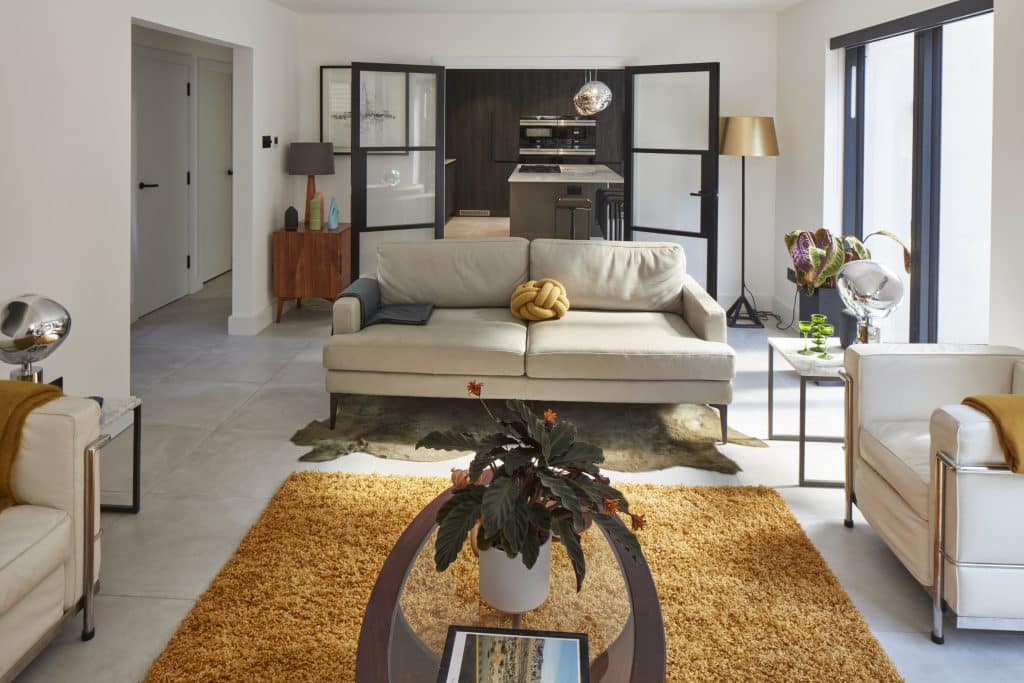 a living room filled with furniture and a fireplace