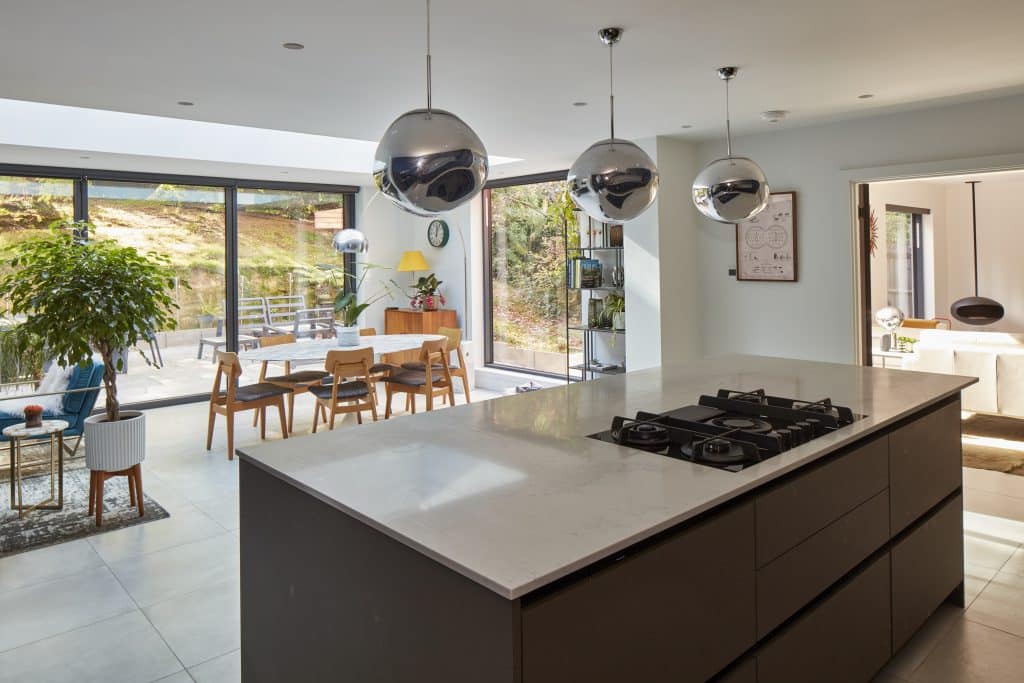 a kitchen with an island in the middle of a room