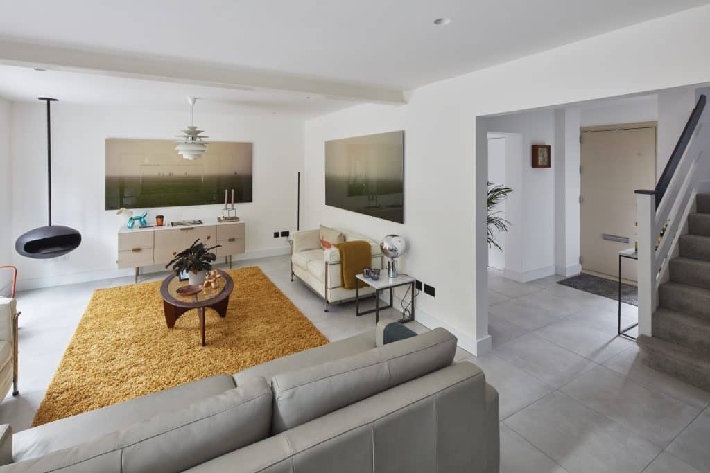 a living room with a sink and a mirror