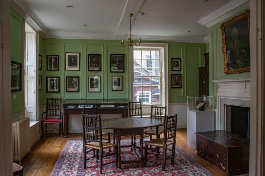 a room filled with furniture and a large window