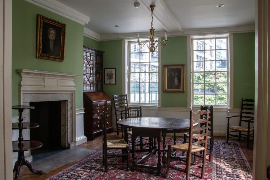 a living room filled with furniture and a large window