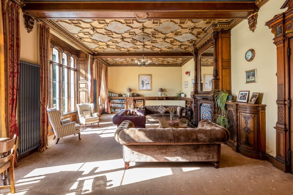 a living room filled with furniture and a fireplace