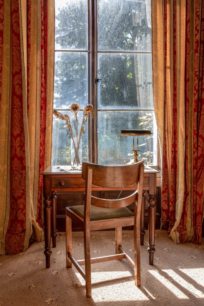a chair sitting in front of a window