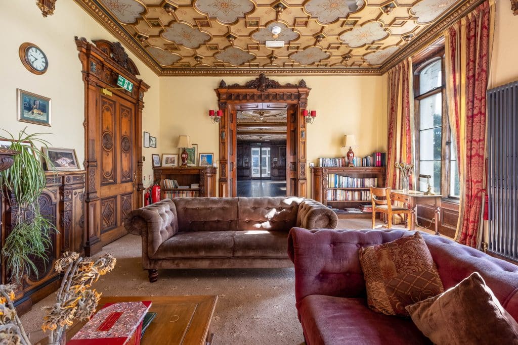 a living room filled with furniture and a fire place