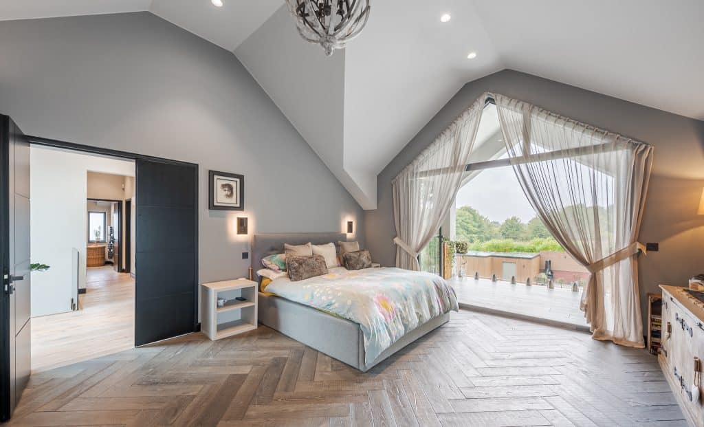 a bedroom with a bed in a room