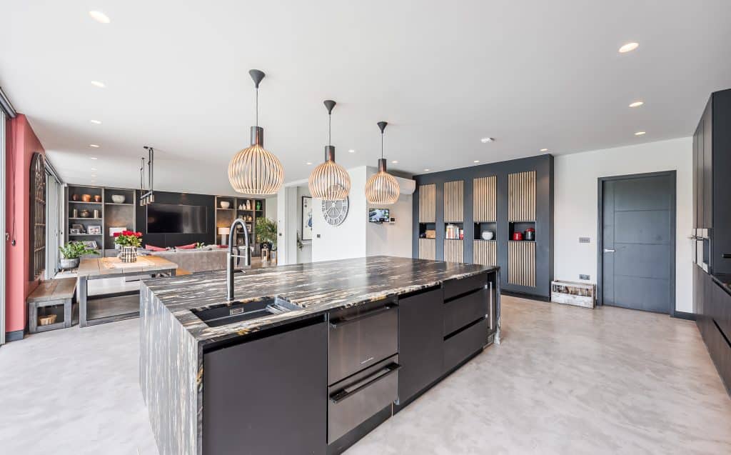 a kitchen with an island in the middle of a room