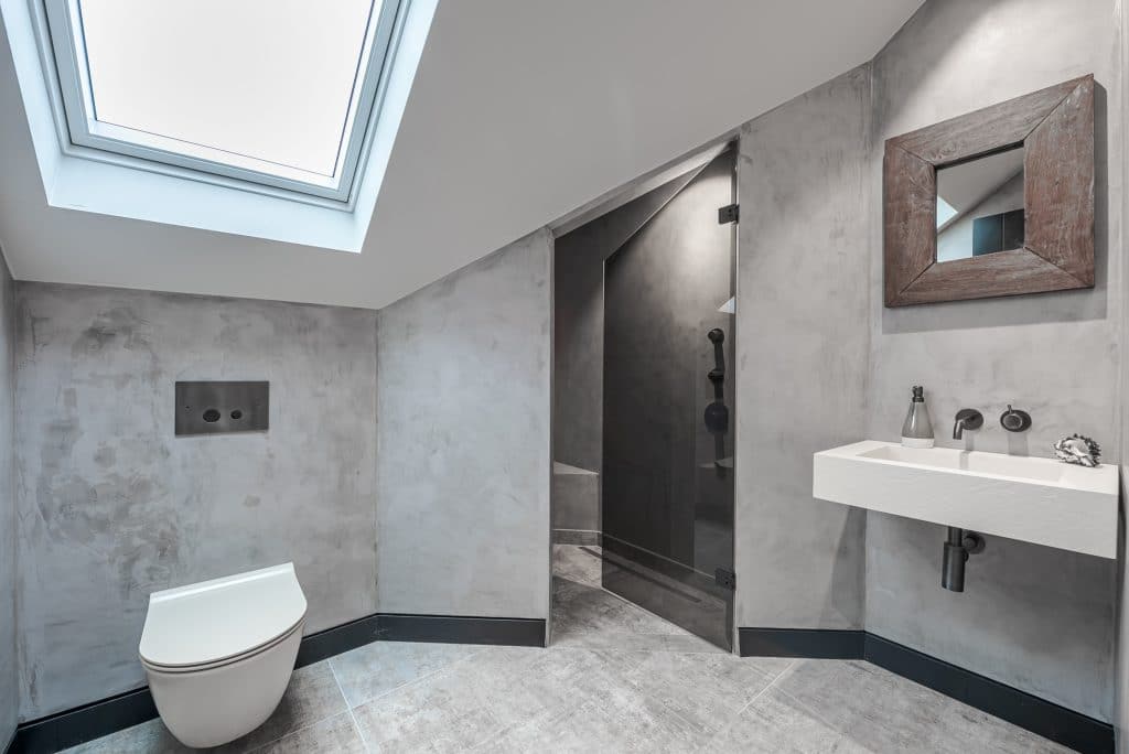 a room with a sink and a mirror