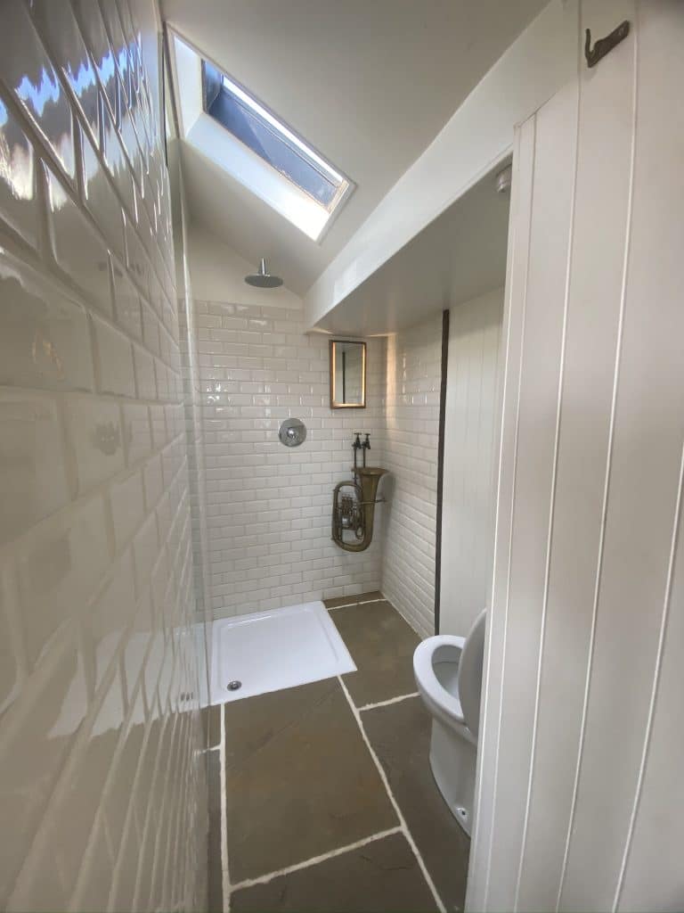 a view of a shower in a small room