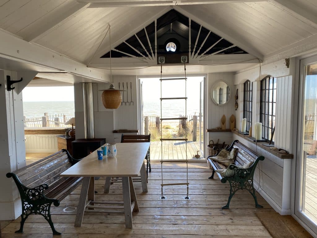 a room filled with furniture and a large window