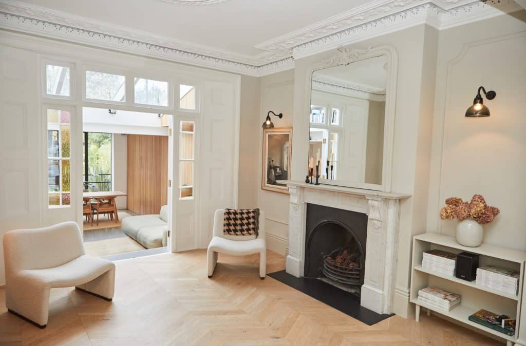 a living room filled with furniture and a fireplace