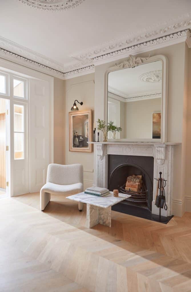 a living room filled with furniture and a fireplace
