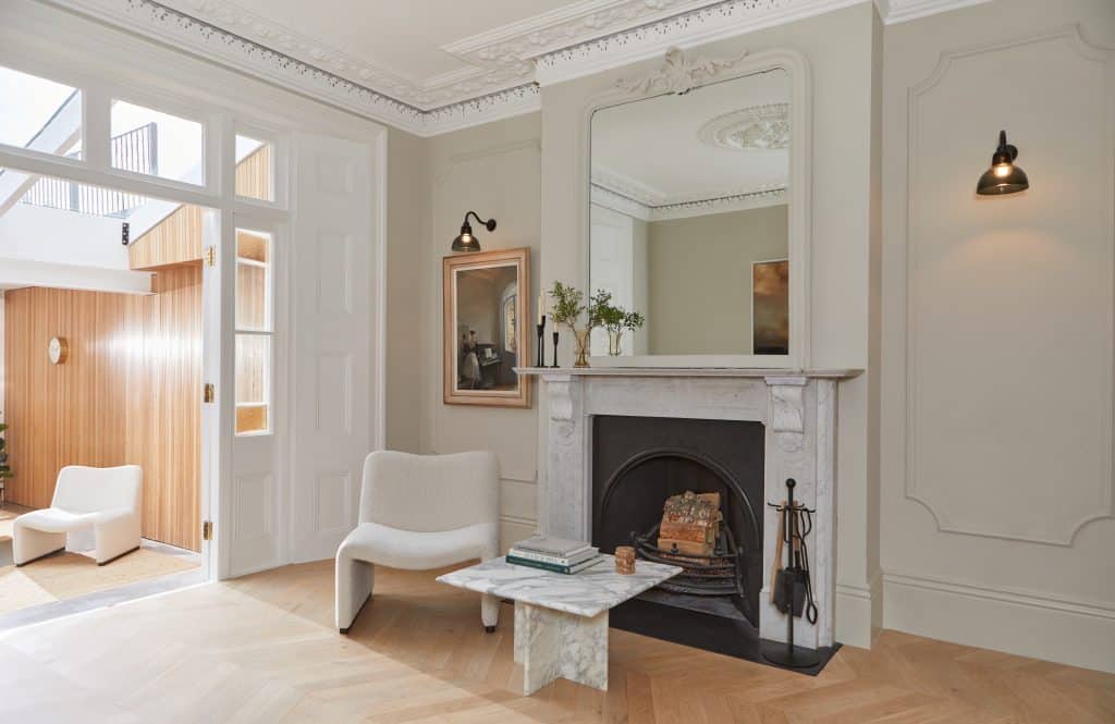 a room filled with furniture and a fireplace