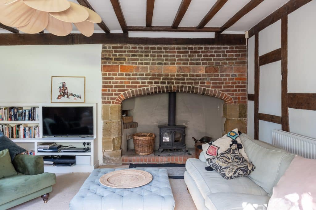 a living room filled with furniture and a fire place