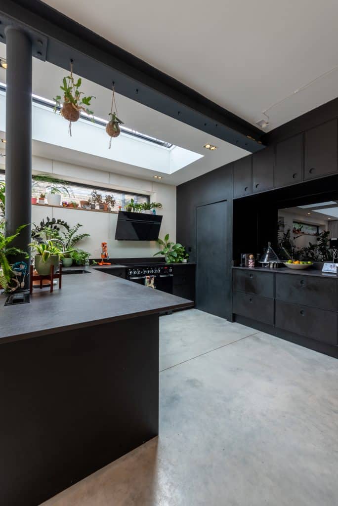 a kitchen area with a building in the background