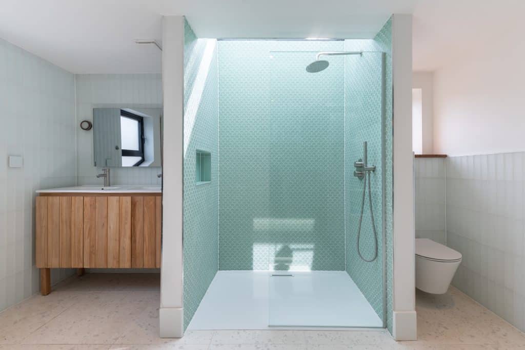 a room with a sink and a shower