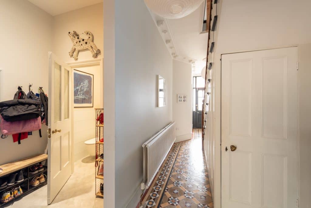 a bedroom with a large mirror