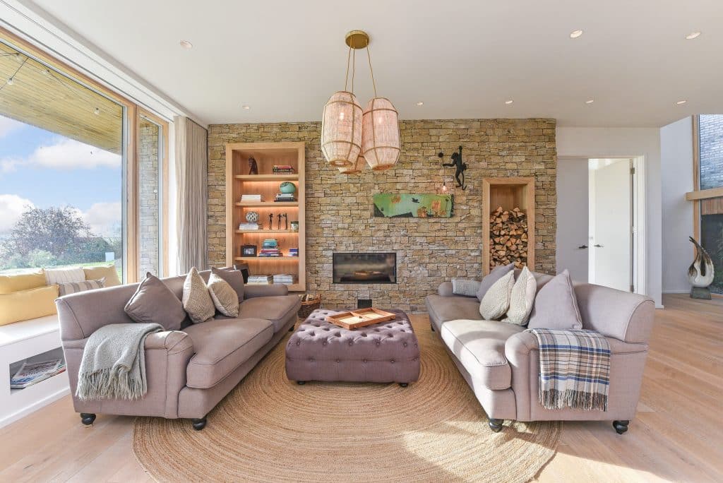 a living room filled with furniture and a large window