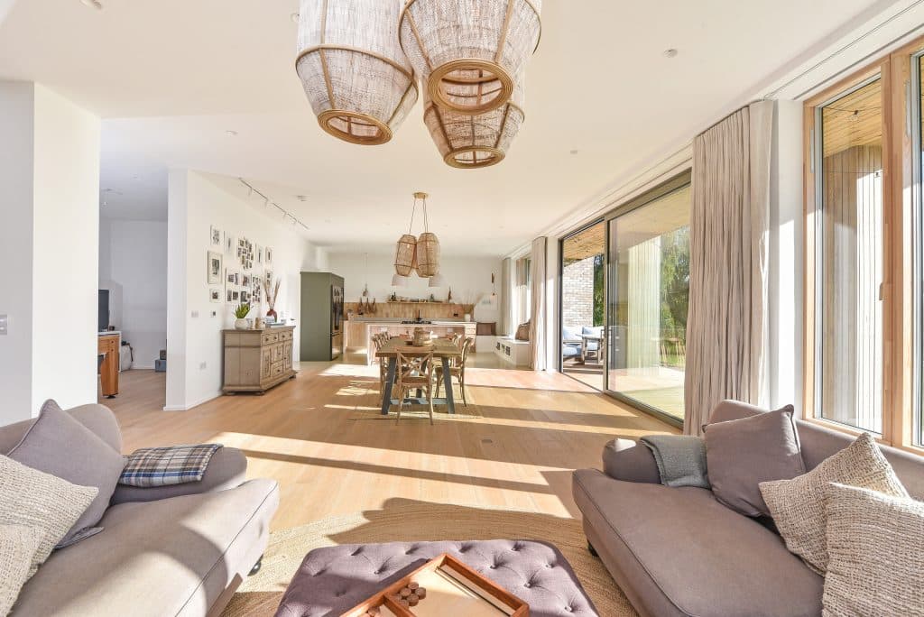 a living room filled with furniture and a large window