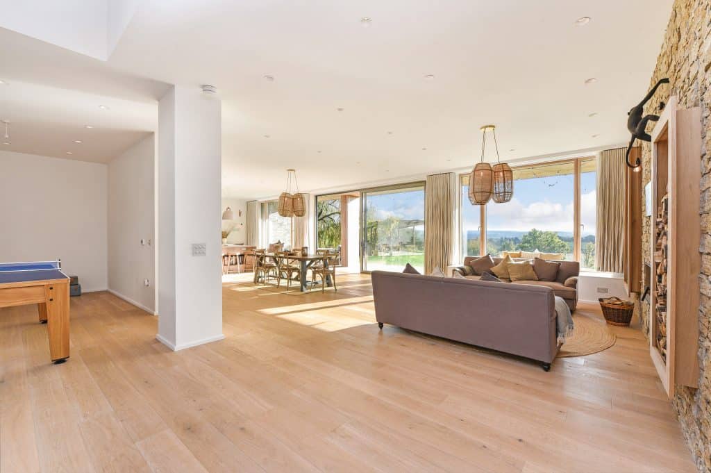 a living room filled with furniture and a wood floor
