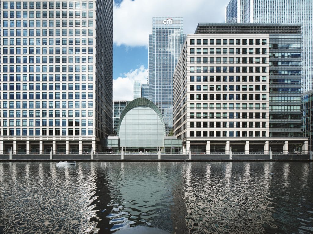 a large building next to a body of water