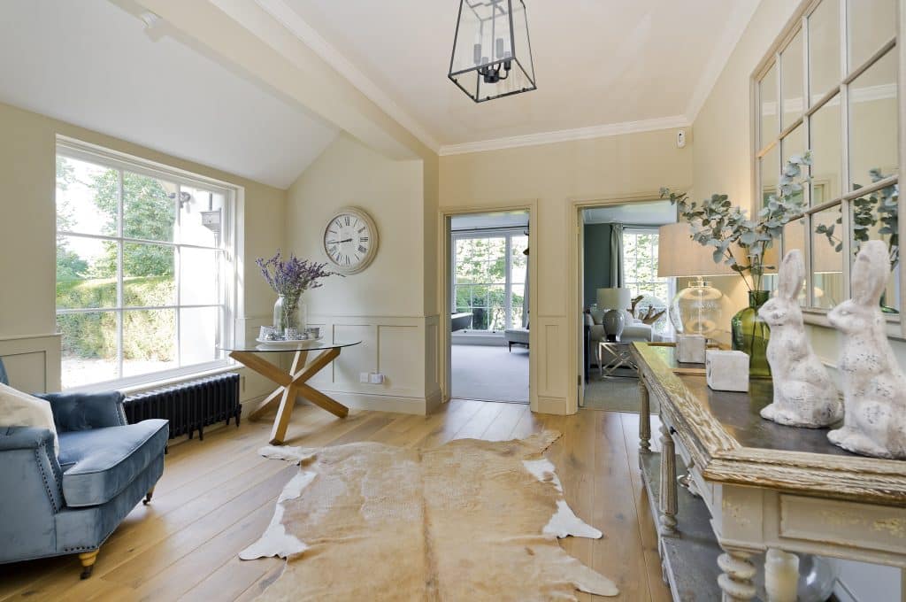 a living room filled with furniture and a fireplace