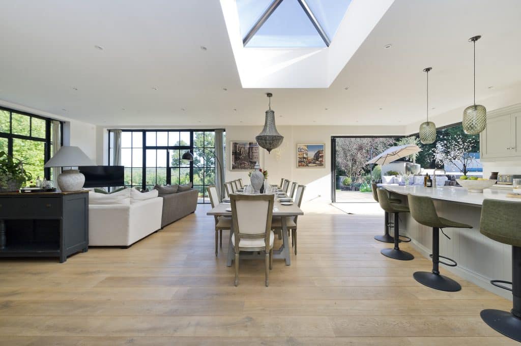 a living room filled with furniture and a large window