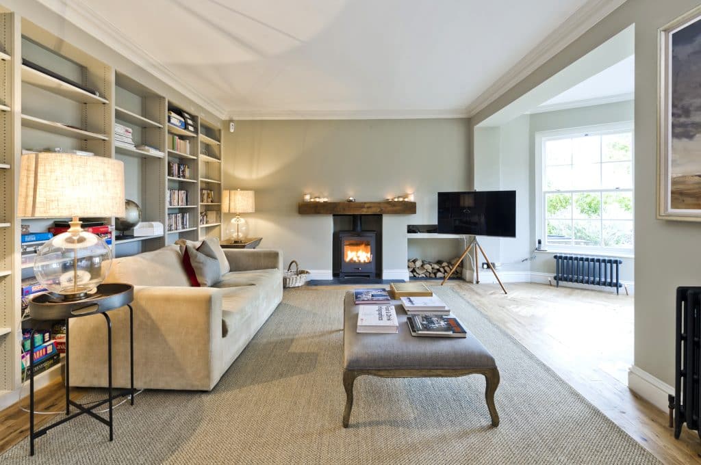 a living room filled with furniture and a large window