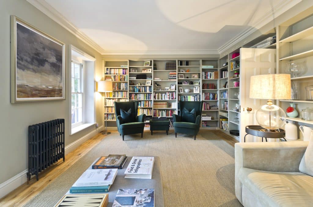 a living room filled with furniture and a fireplace