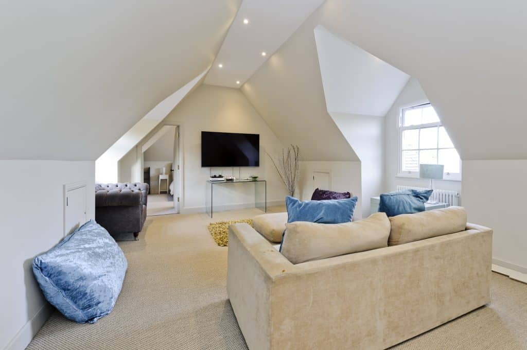 a living room filled with furniture and a fireplace