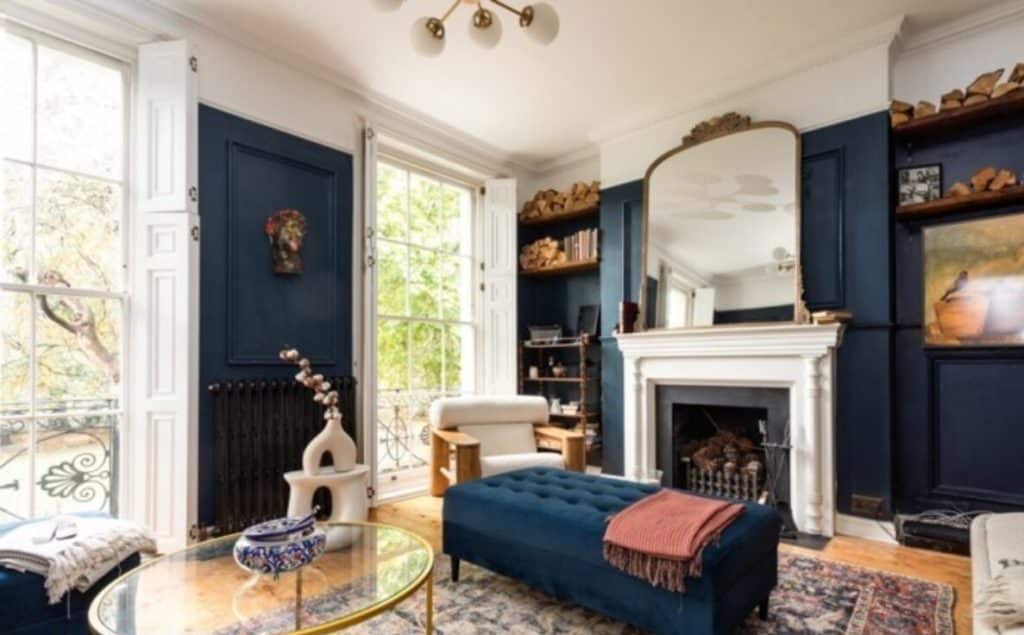 a living room filled with furniture and a fire place