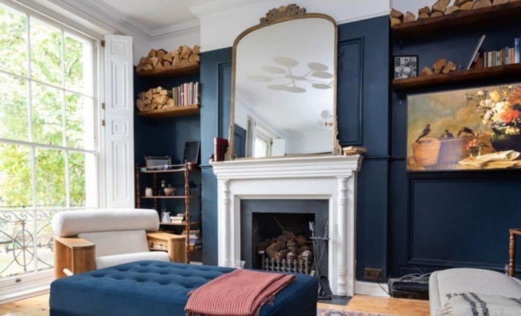 a living room filled with furniture and a fire place
