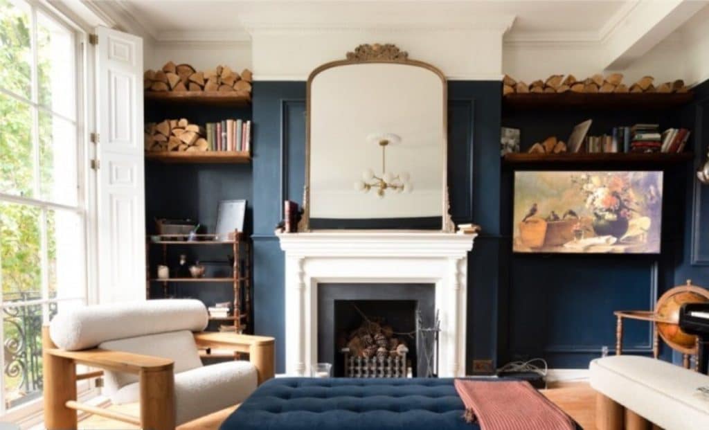 a living room filled with furniture and a fire place
