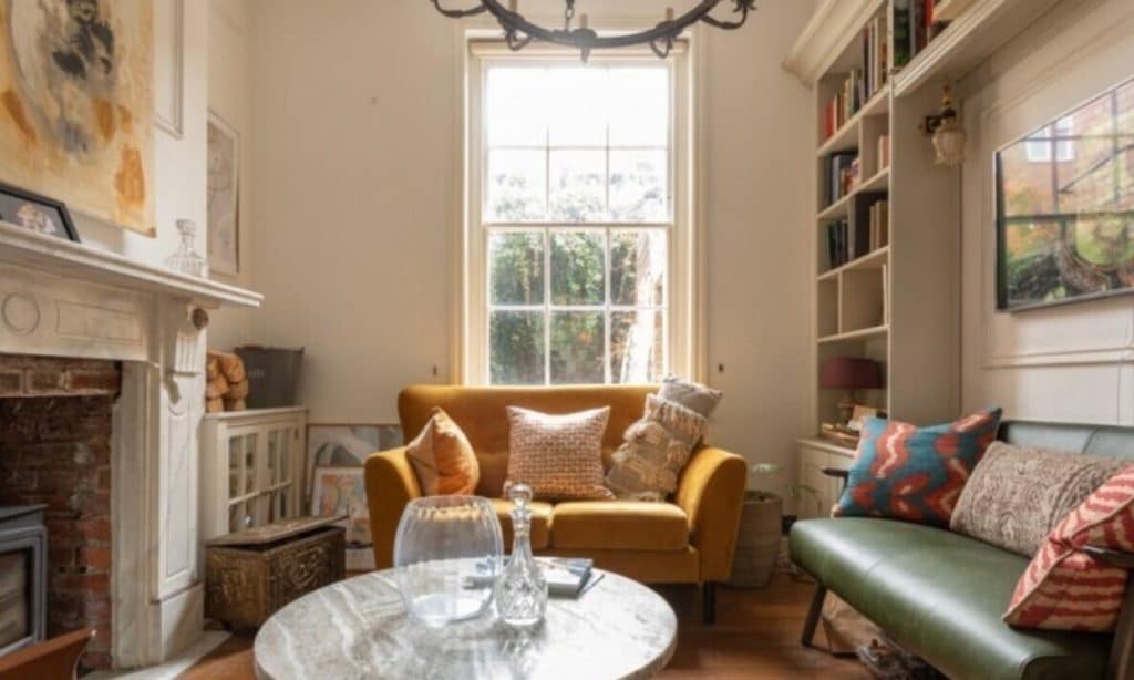 a living room filled with furniture and a fire place