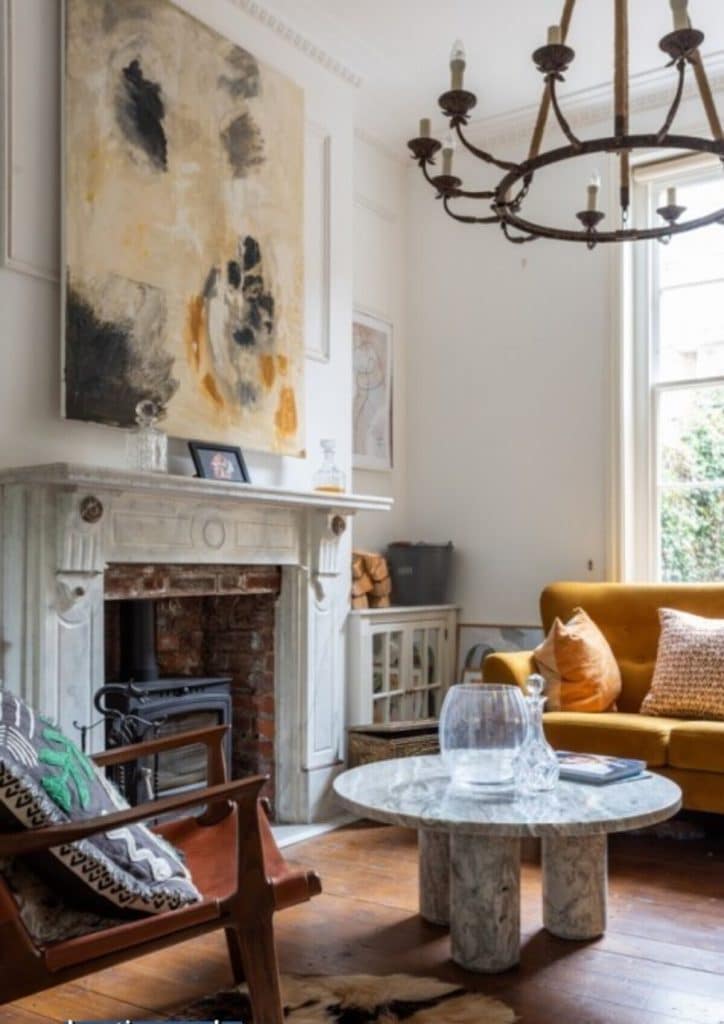 a living room filled with furniture and a fire place