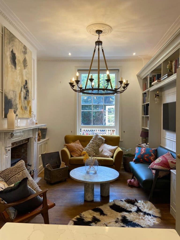 a living room filled with furniture and a fire place