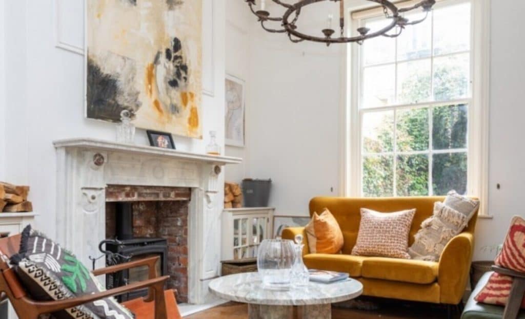 a living room filled with furniture and a fire place