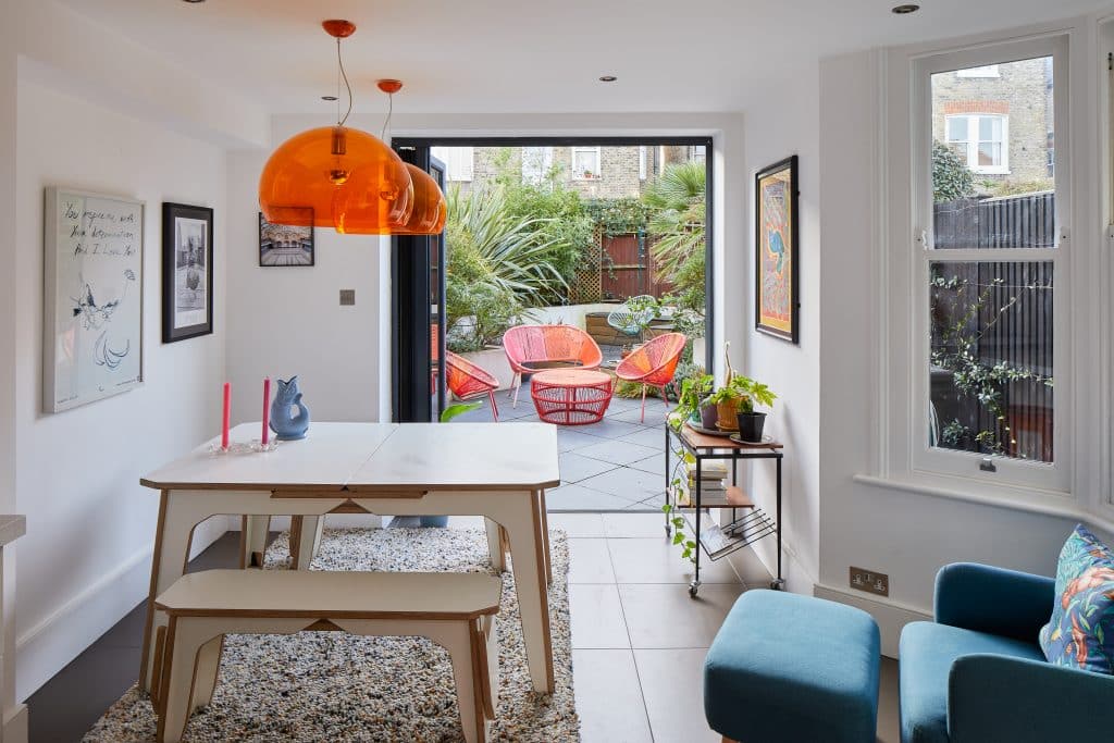 a living room filled with furniture and a large window