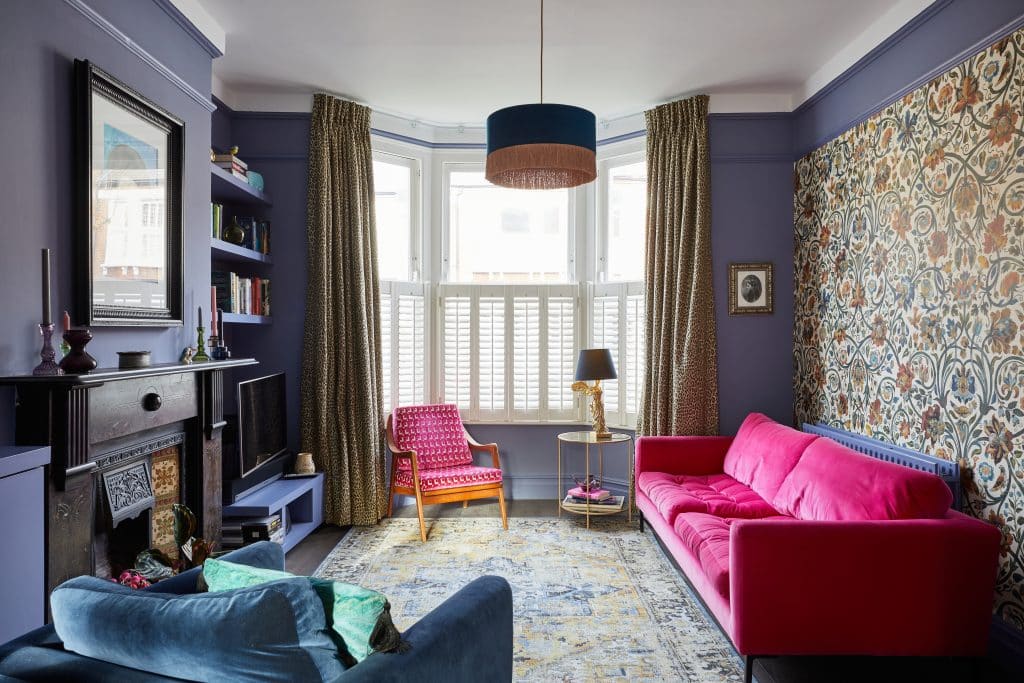 a living room filled with furniture and a fire place
