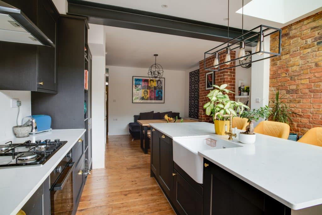 a kitchen with an island in the middle of a table