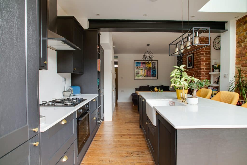 a kitchen with a table and looking at the camera