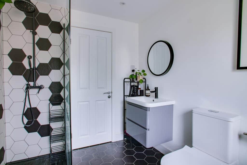 a room with a sink and a mirror